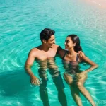 모리셔스 여행 중 로맨틱한 장소 - **Prompt:** A young, diverse couple, both wearing stylish, modest swimsuits, are gently floating in ...